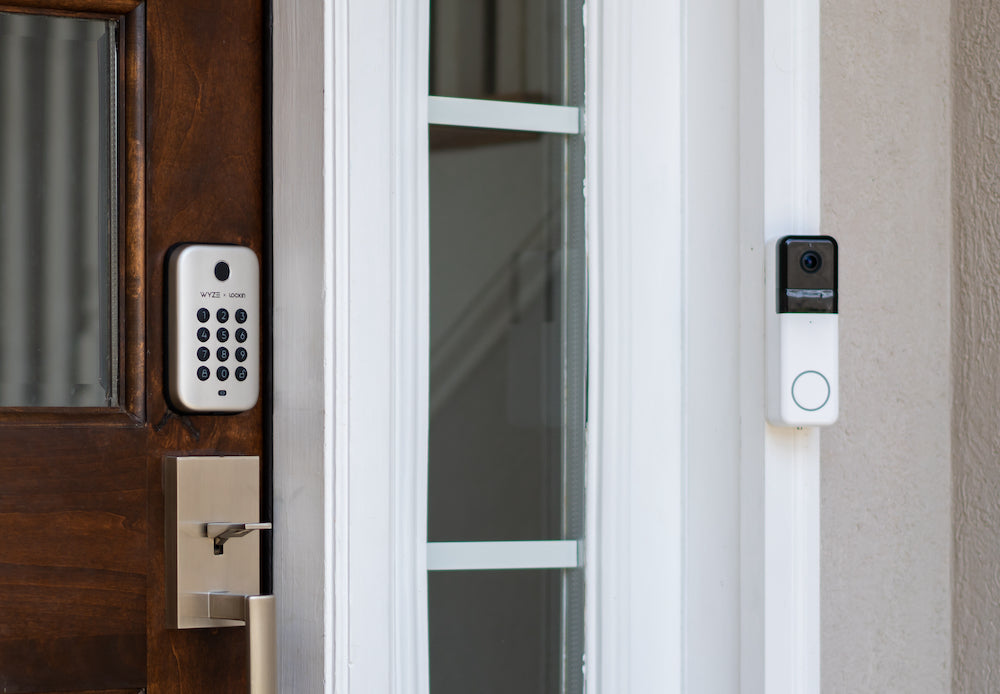 Lock bolt installed on front door with a wyze doorbell pro on wall