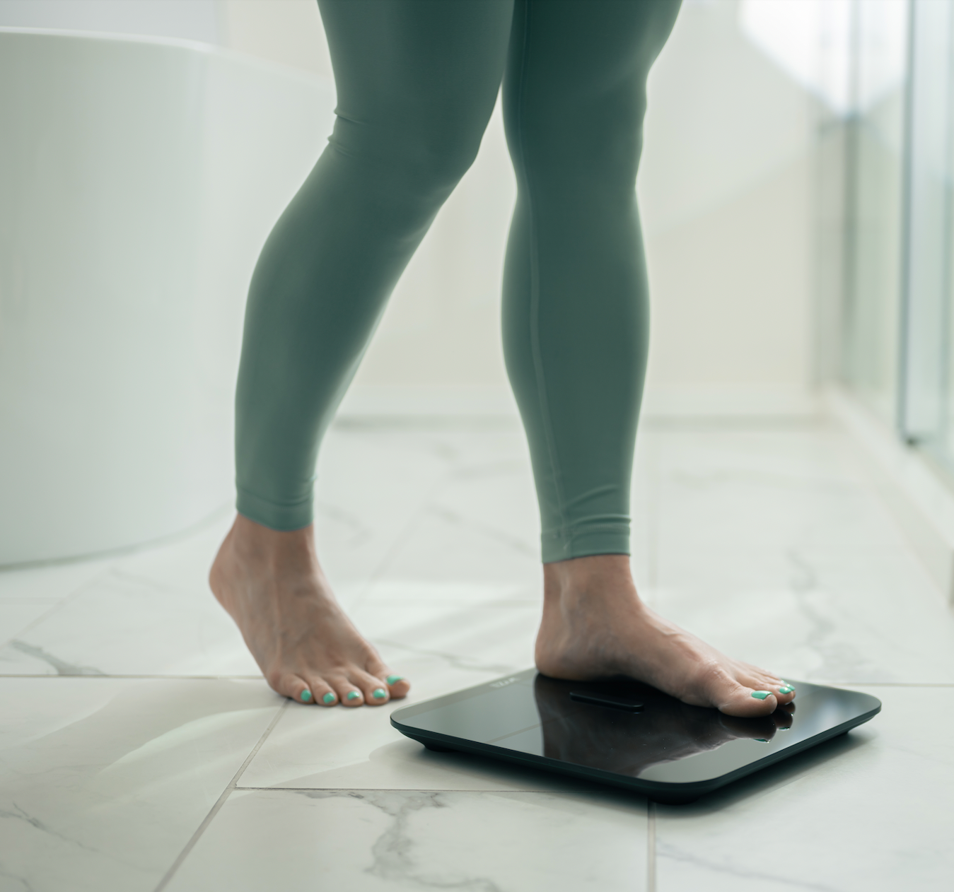 instant step to wake with woman stepping on scale
