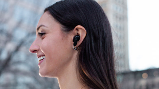 Person with wyze buds pro in their ear