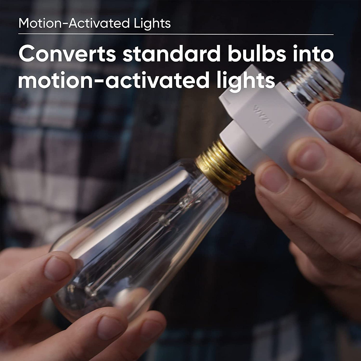 Person holding a Wyze Lamp Socket that is attached to an edison bulb. Text overlay that says "Converts standard bulbs into motion-activated lights."