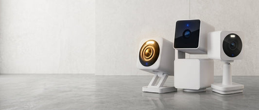 A white speaker with a blue light on it.
