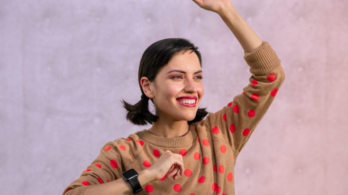 Person holding their arms up with the wyze watch 44 on their wrist