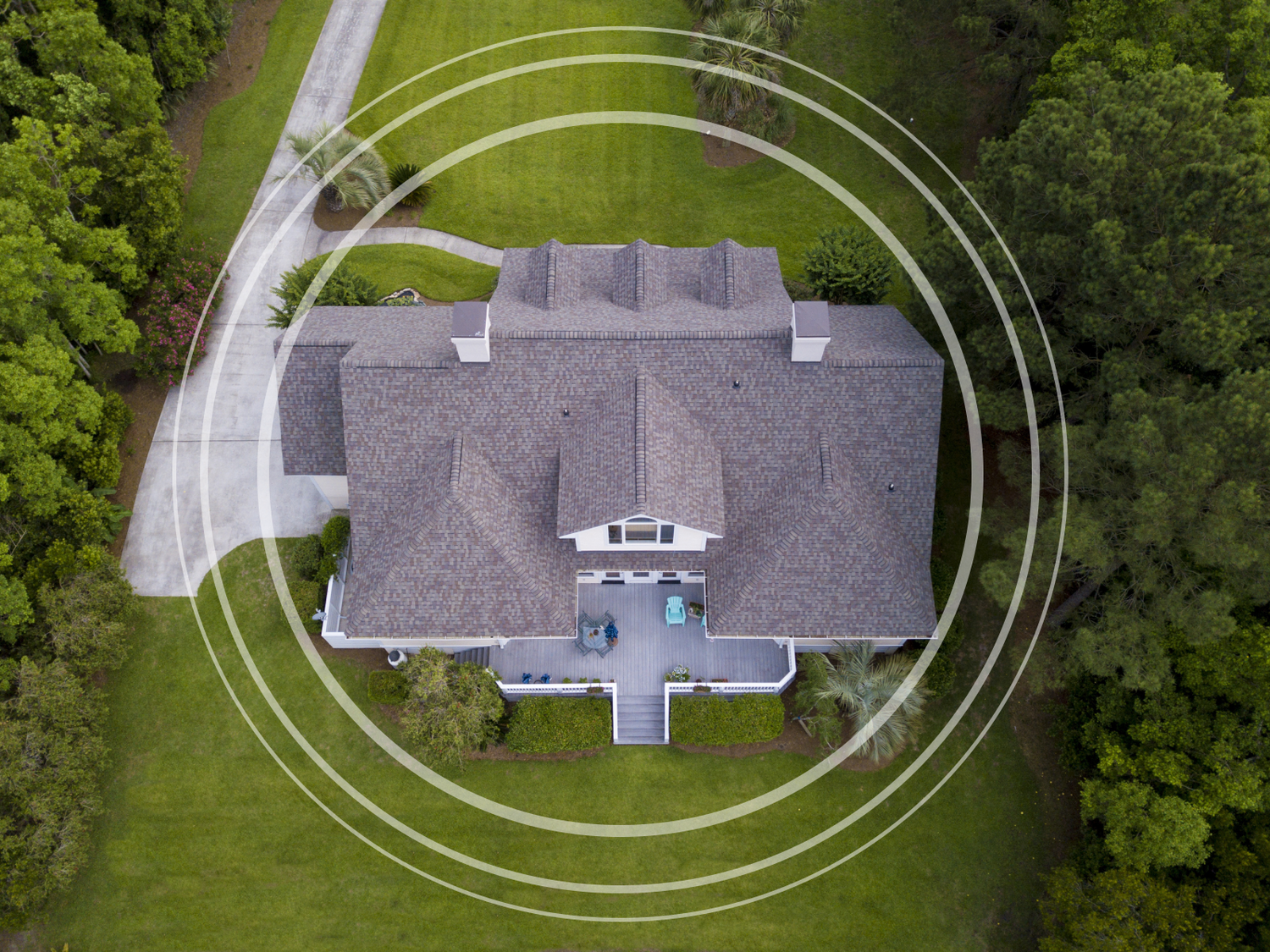 Overhead view of a large home with circle overlays surrounding the house.