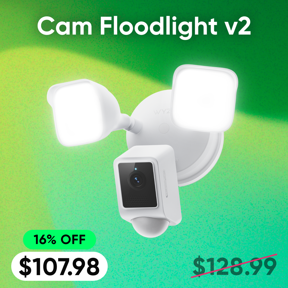 White floodlight camera with a green gradient background and price tag.