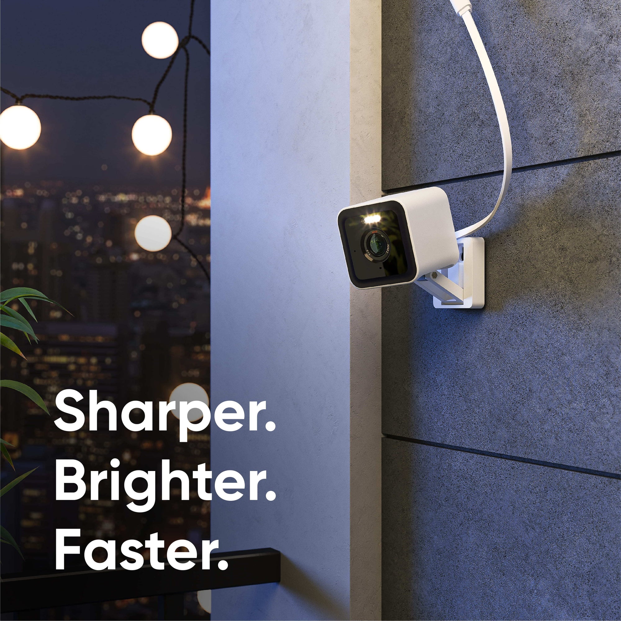 A white camera attached to a wall.