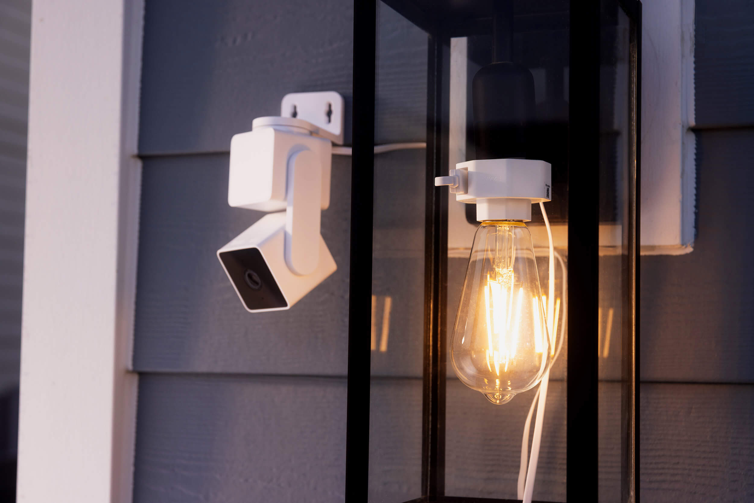 A white light bulb with a camera attached to it.