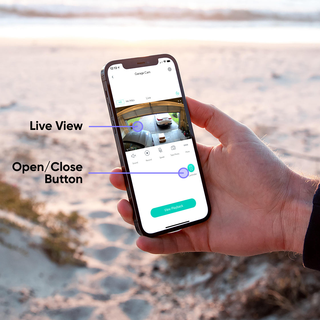 A hand holding a phone with the Wyze app open.