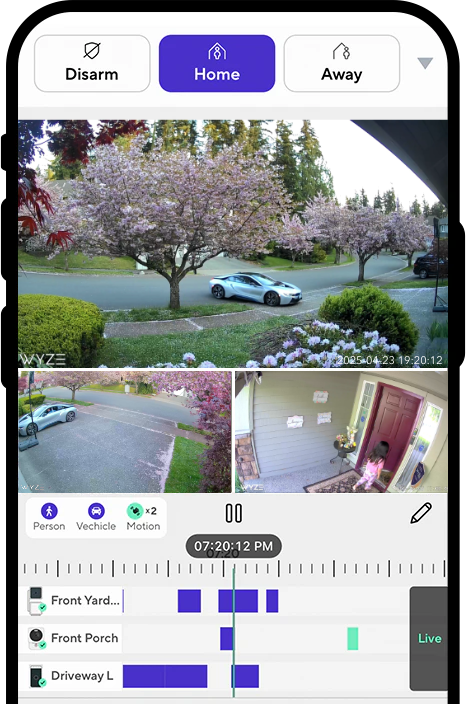 A monitor of a street with a car driving by.