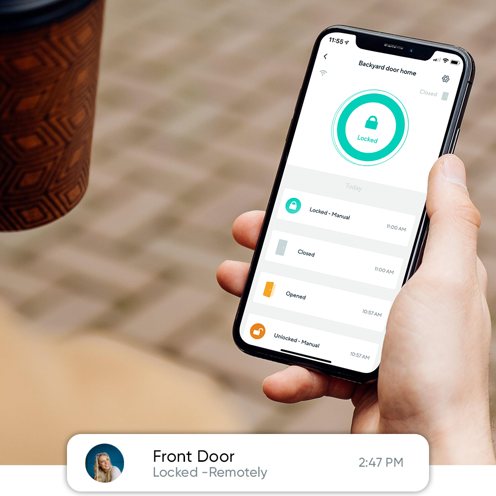 Person holding phone with Wyze app open and the status of their backyard door being locked