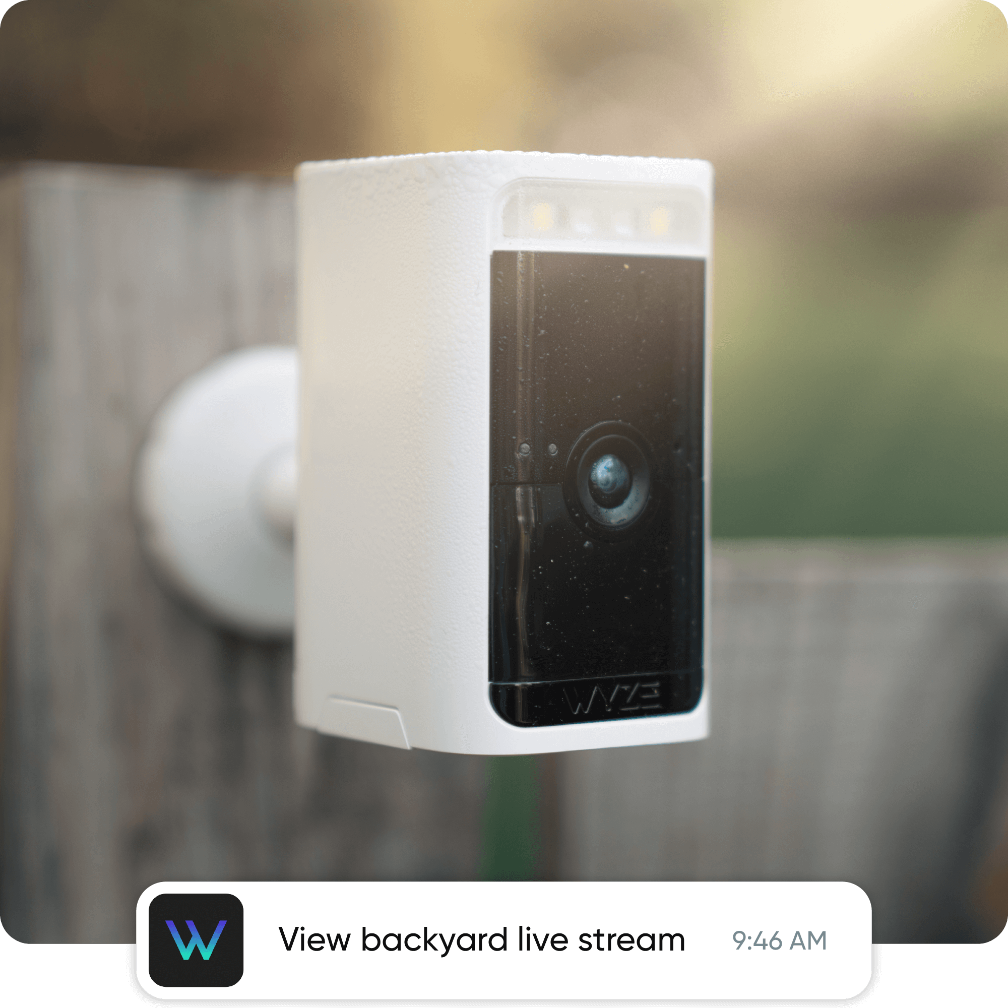 A peaceful nursery at night, softly lit by Wyze Night Lights, with a parent checking the Wyze app.