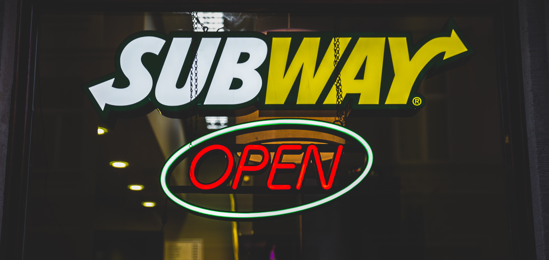 A neon sign that says "Open" in red.