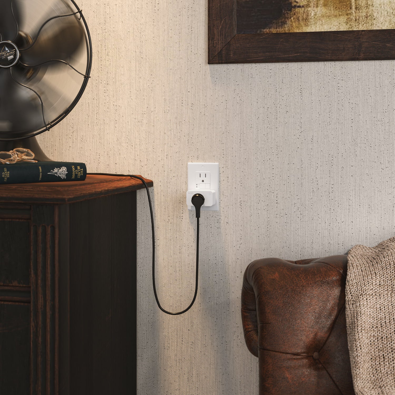 Wyze Plug in a wall outlet with a small house fan attached