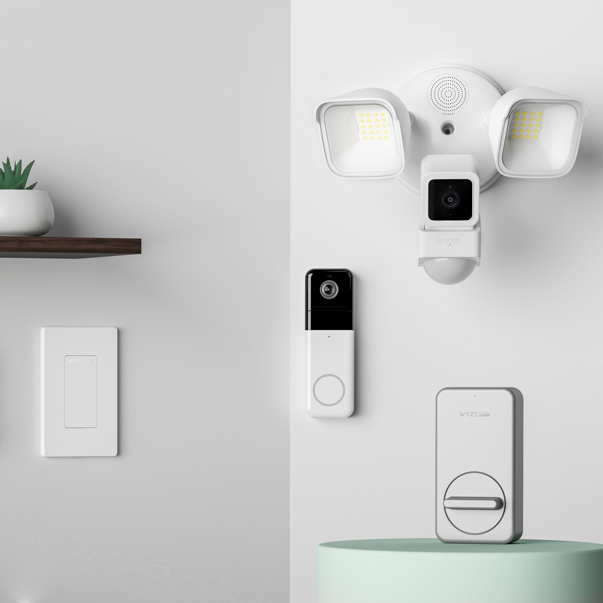 A white camera on a wall.