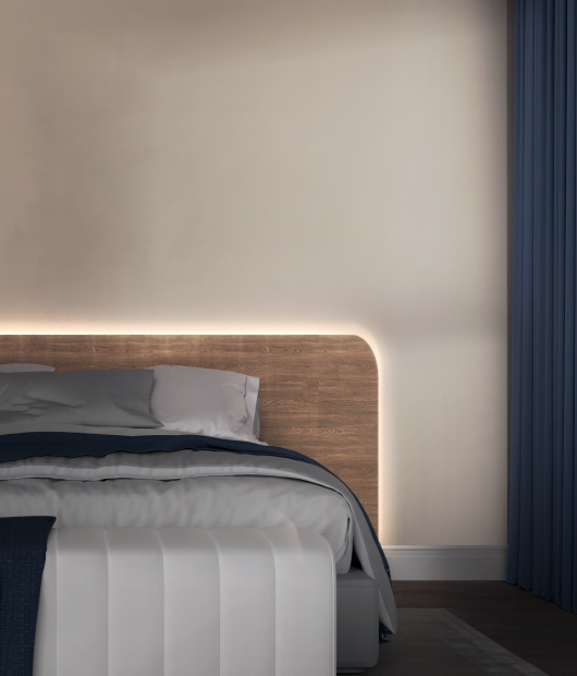 light strip pro lighting up behind a bed