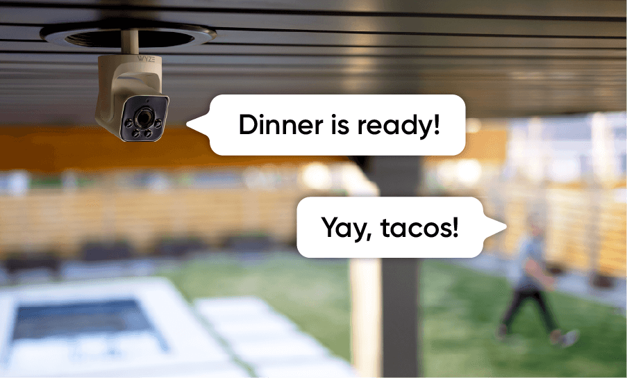 Family using Wyze outdoor cam with two-way talk for dinner.
