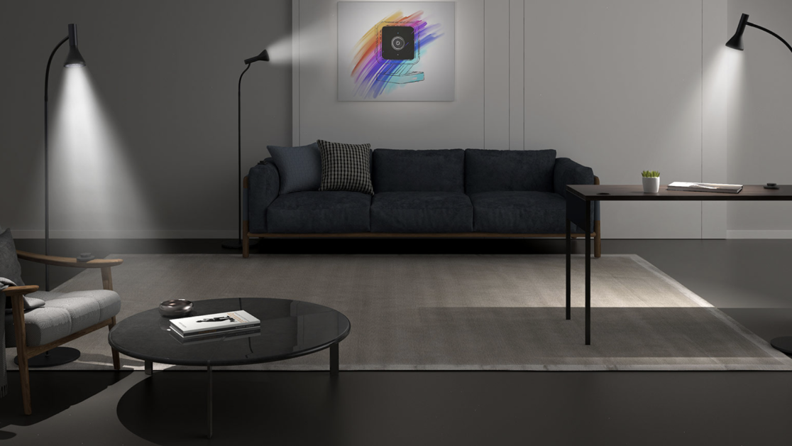 A floor lamp with a light on in a living room.