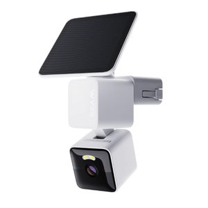 White security camera with a black solar panel on a white background