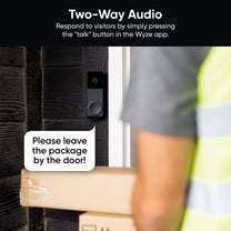 A man is holding a box with a Wyze Duo Cam Doorbell. This doorbell has dual camera views for people and packages.