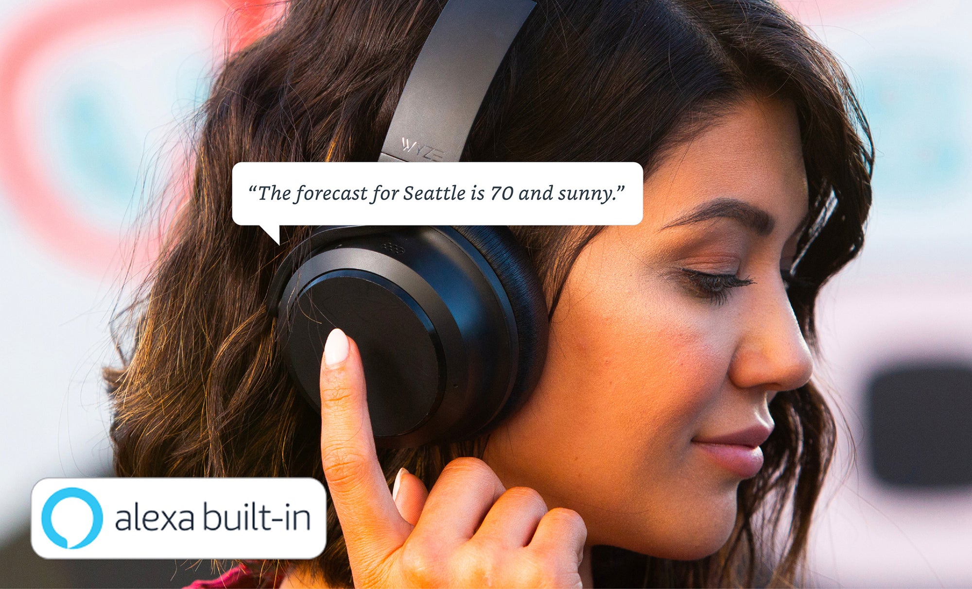 A woman wearing headphones and touching the side to ask a question.