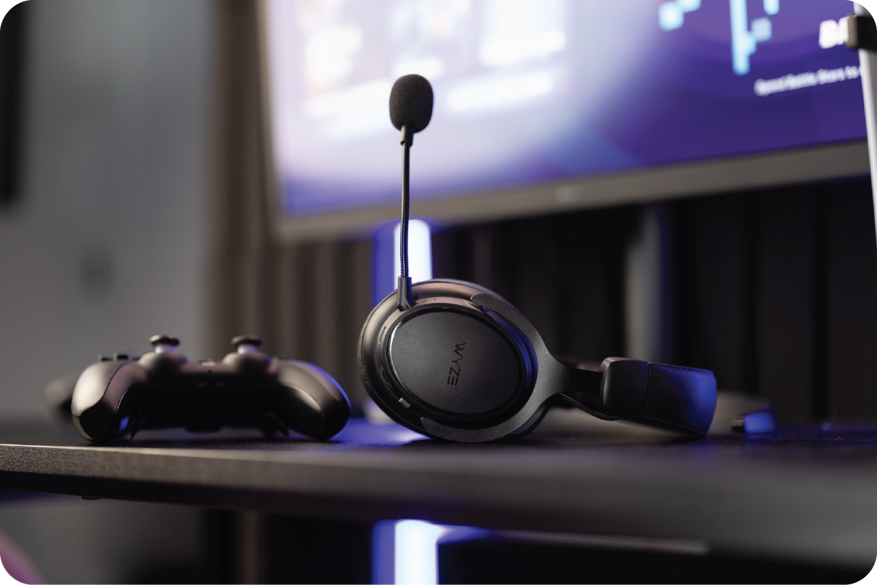Wireless Gaming Headset laying on table next to gaming controller
