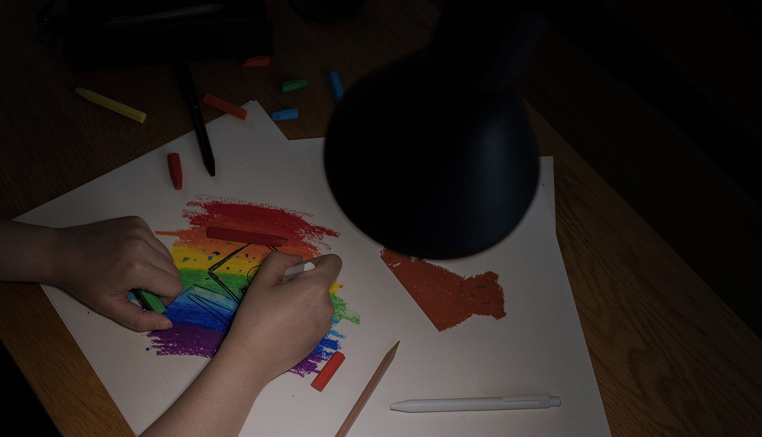 person coloring without floor lamp turned on