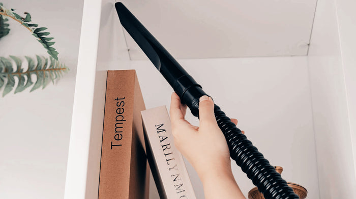 Hose Extension Tool on bookshelf