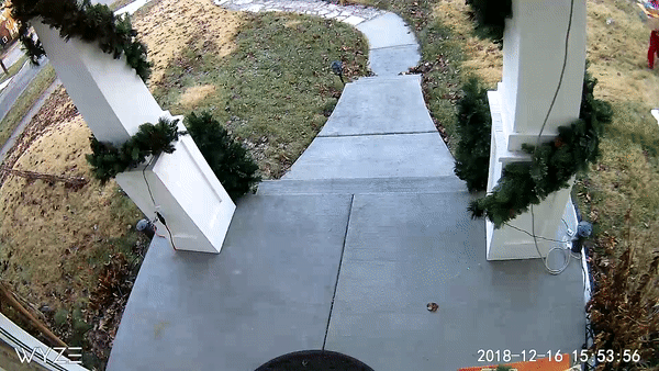 A sidewalk leading to a house with a pathway. 2
