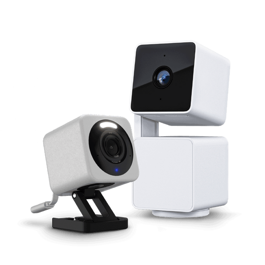 Two white security cameras on a transparent background