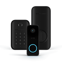 A black and blue security device with a blue keypad.