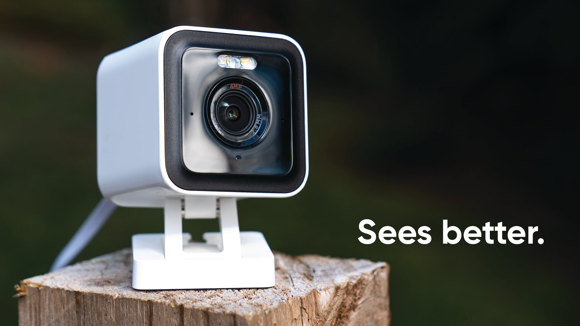 A white camera with a green lens.
