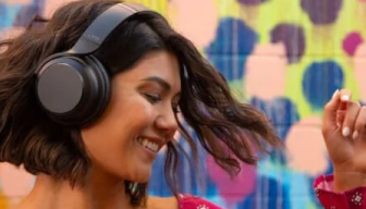 Woman dancing while wearing Noise-Cancelling Headphones