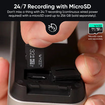 A person is holding a Wyze Battery Video Doorbell. The doorbell is black and has a chime.