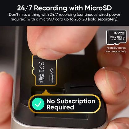 Hand inserting a microSD card into a device with Wyze branding, highlighting 24/7 recording capability.