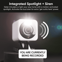 A white camera with a microSD card.