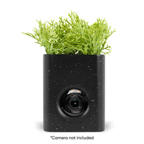 A black vase with a camera not included.