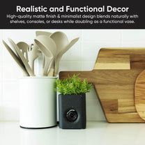 A black and white speckled Wyze Cam Vase.