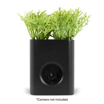 A black vase with a Wyze Cam inside.