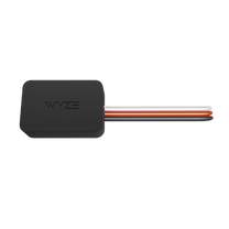 A black and orange device with the word Wyze on it.