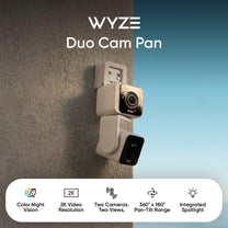 A white camera with a black lens.