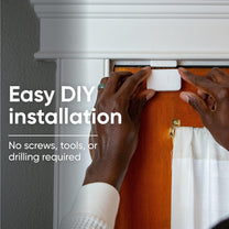 A person is installing a doorbell camera to keep their home safe.