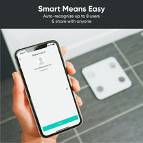 A person holding a smartphone with the Wyze Scale S app open.