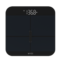 A black and green scale with a digital display showing the weight in pounds and ounces.