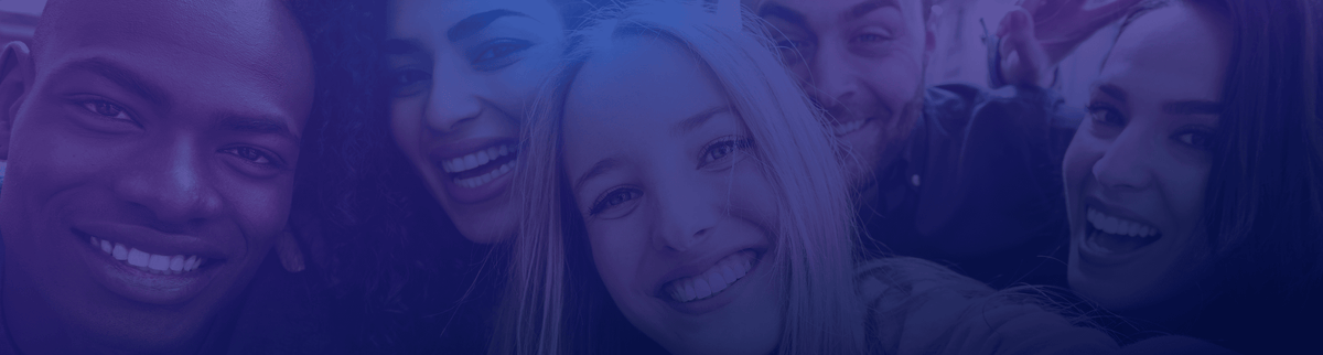 Three girls smiling at the camera.