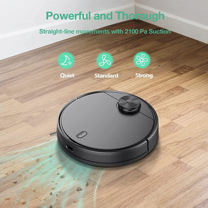 Robot vacuum cleaning up dirt and food on wood floors. Green text overlay that says "Powerful and Thorough. Straight-line movements with 2100 Pa Suction."