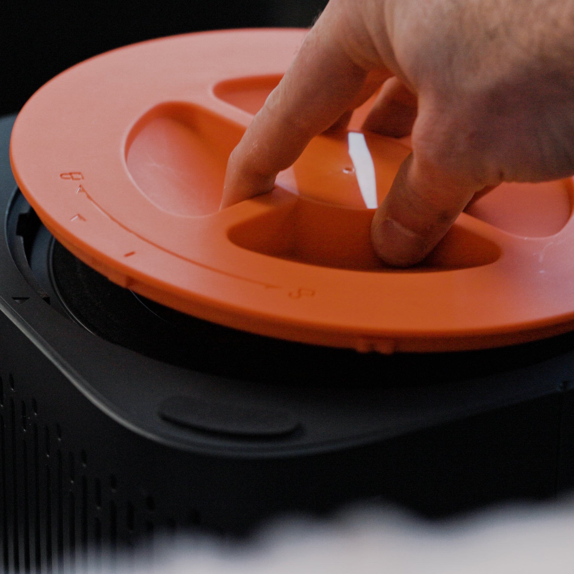 Hand replacing an air filter