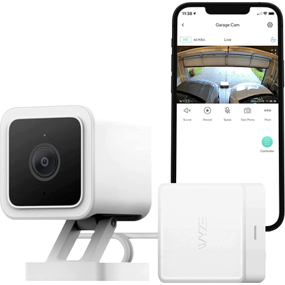 Wyze cam with garage door controller and smart phone in background