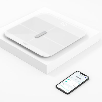 White Wyze Scale X and phone with Wyze app displayed on screen