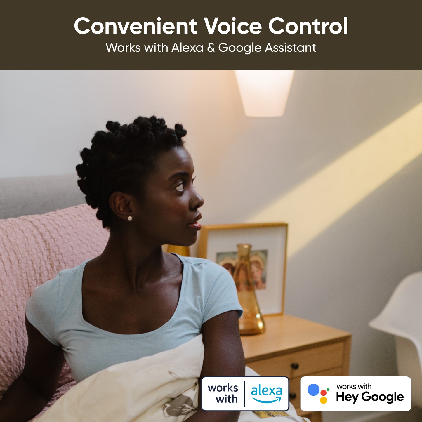 Woman in bed with the room lit with warm lighting. White text overlay that says "Works with Alexa & Google Assistant."