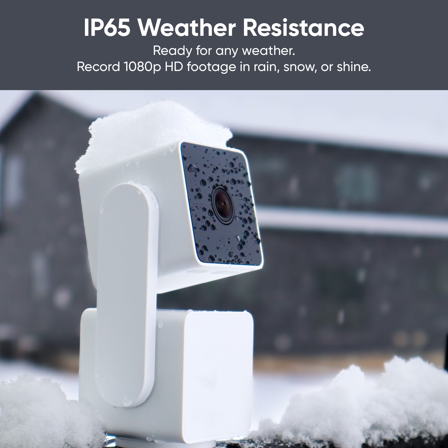 Text overlay "IP65 Weather Resistance.". Image shows a Wyze Cam Pan v3 outside with snow around and on top of it.