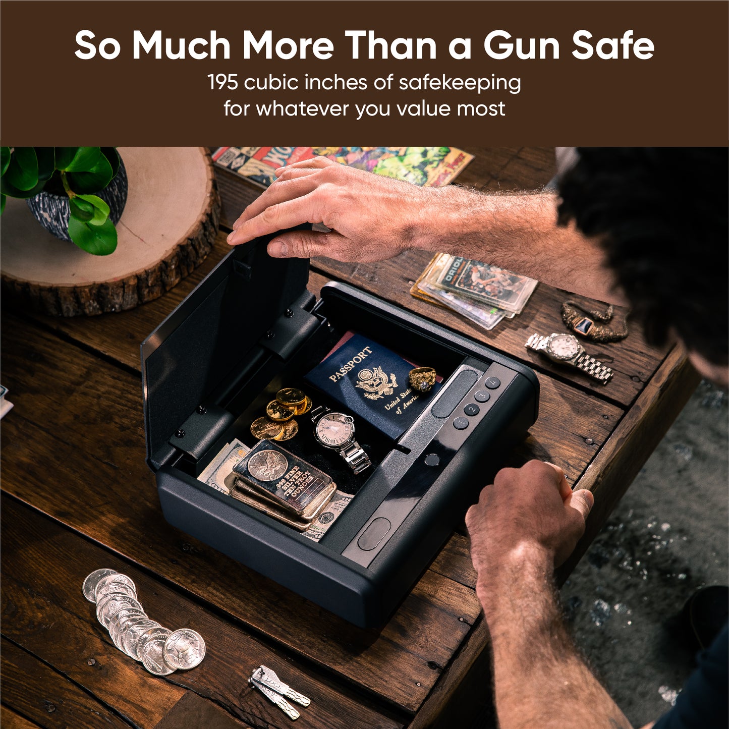 Man with hand on the opened lid of the portable safe with gold, silver, a watch, and passport inside of the safe.